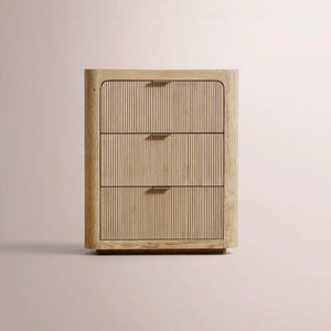 Wooden cabinet with three drawers on a beige background