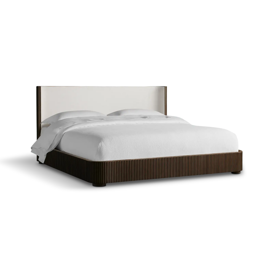 Bed with white bedding on a white background
