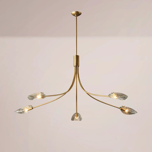 A modern five-light brass chandelier with curved arms and clear textured glass shades, shown against a plain light beige background.